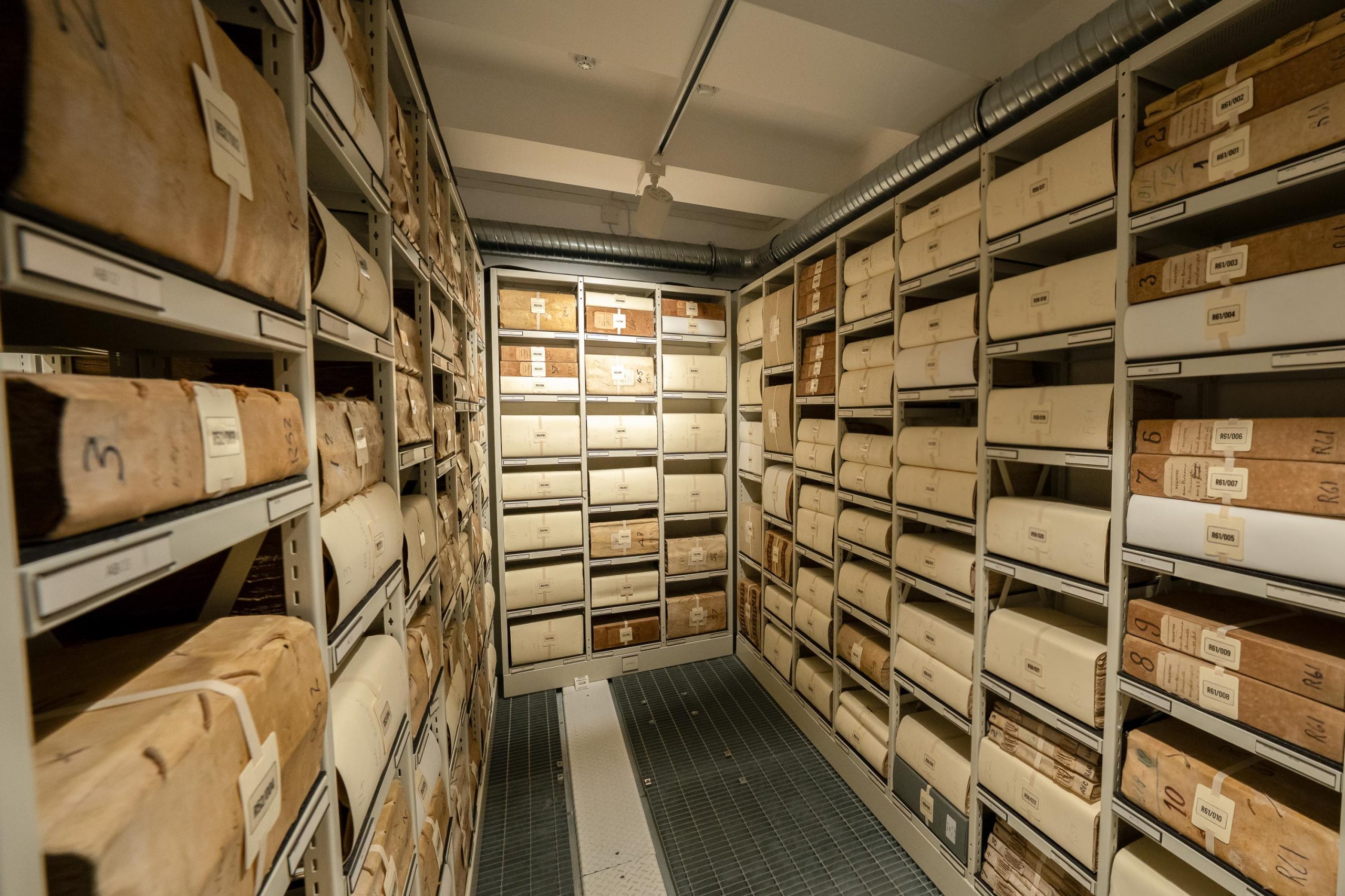 Photo of repository shelves filled with manuscripts